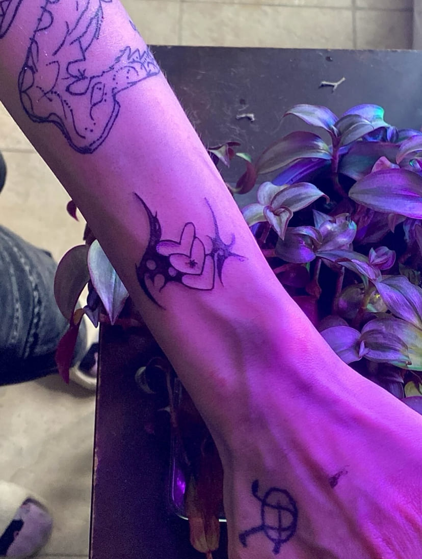 Sigil on the ankle photographed under violet light