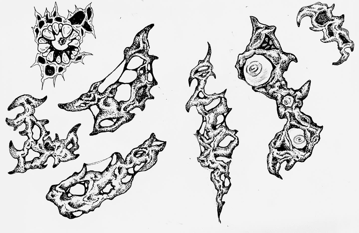 Hand-inked flash sheet of spiked sigil and bone designs on white paper