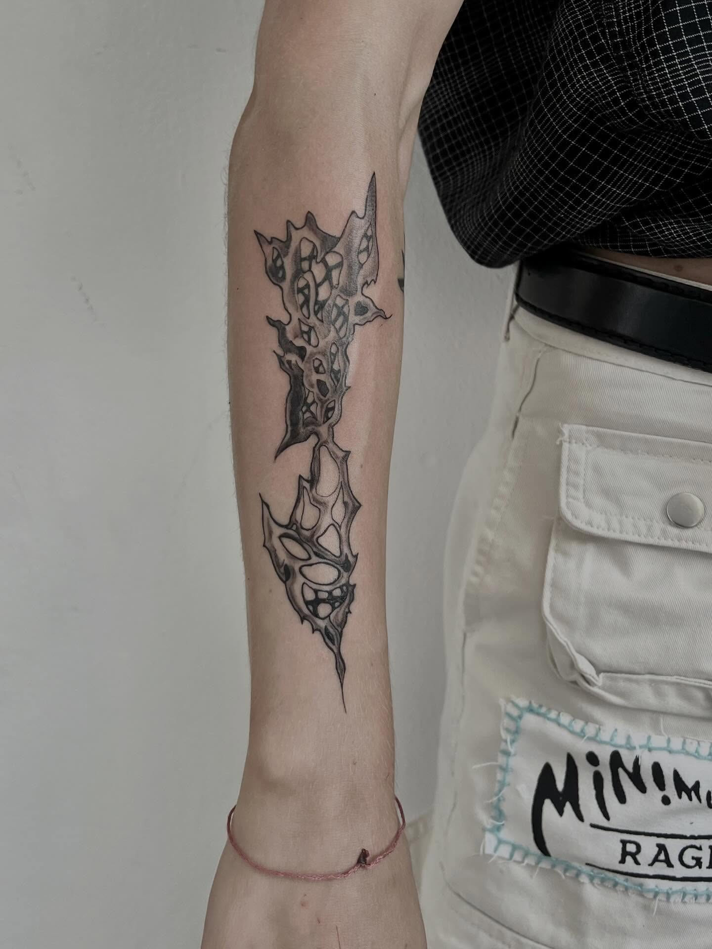 Spiked cluster running down the forearm, healed