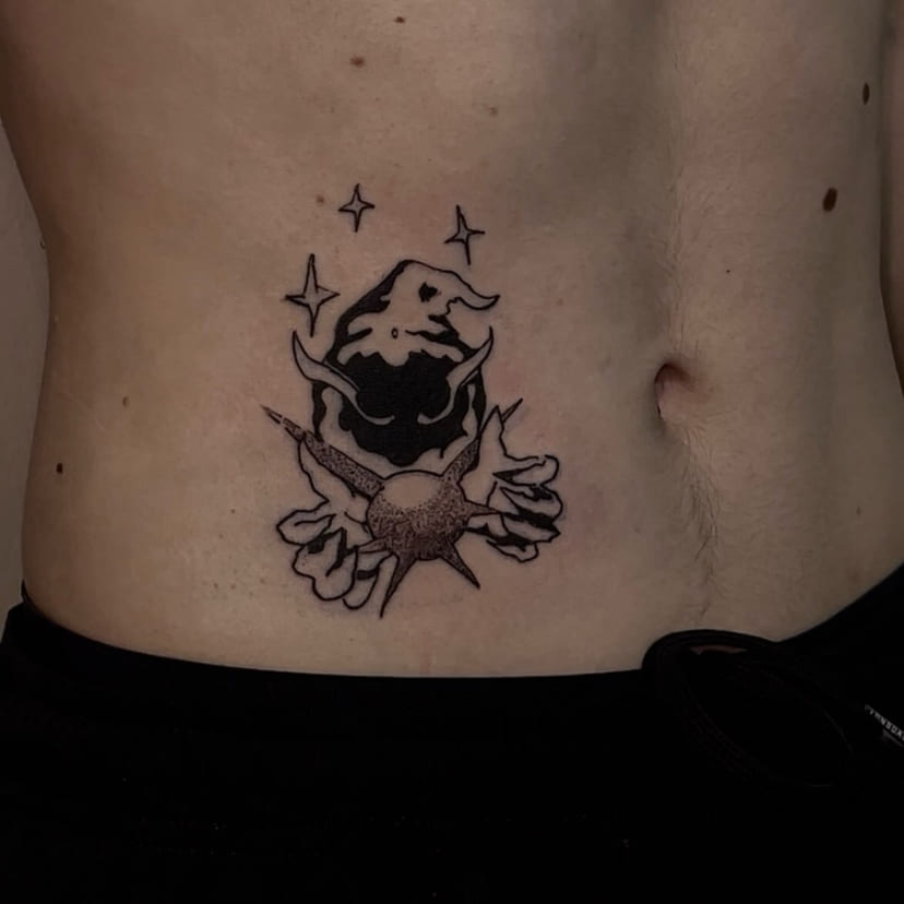 Imp holding an orb on the stomach, close view